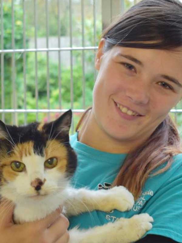 Volunteer at Woodside holding cat